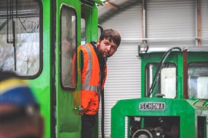 A volunteer driving the schoma loco at Crowle Peatland Railway