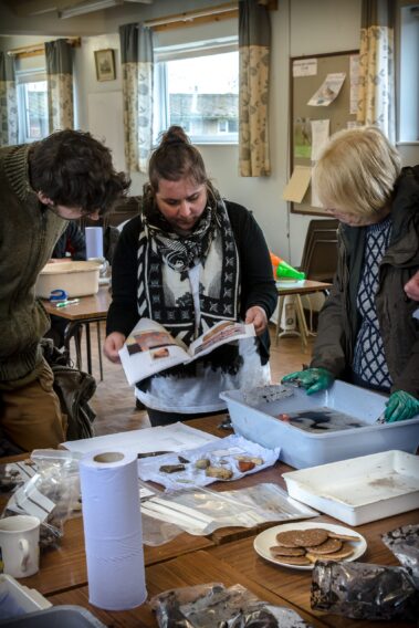 Washing down the finds after a mornings field walking