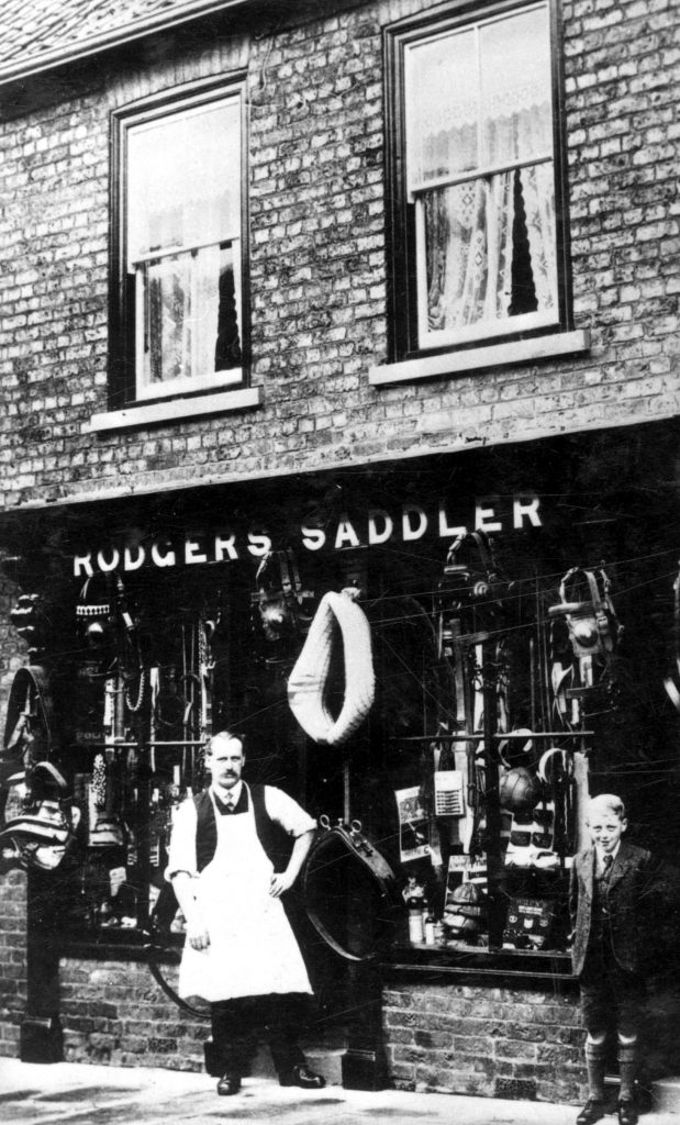 Wilf Rogers outside his saddlers shop in Epworth circa 1910.